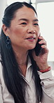Asian woman, phone call and talking in office for business negotiation, insurance deal or offer. Mobile, conversation and communication with mature manager for policy sales, question and feedback