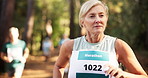 Woman, running and forest with group for marathon challenge, race or endurance test in nature. Mature, female person or runner with people for sport event, jogging trail or outdoor fitness in woods