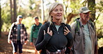 Hiking, woman and group in woods, walking and journey for backpacking in environment and adventure. Outdoor, trekking and traveller on holiday in nature, forest and people on trip for exploration