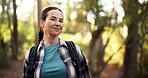 Face, happy and woman hiking in forest for trekking adventure, travel and fitness holiday. Portrait, female person and thinking for backpacking hobby, sightseeing and explore journey for getaway trip