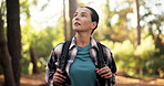Hiking, woman and walk in woods for fitness adventure, weekend hobby and cardio wellness. Nature person, journey and relax with backpack for trekking, explore and holiday sightseeing in forest