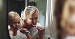 Mirror, mother and child with brush for teeth, dental care and bonding together with morning routine. Bathroom, mom and girl with habit for oral hygiene, fresh breath and wellness for health at home 