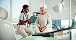Talking, senior woman and physiotherapist with tablet, rehabilitation and tracking process with web. Hospital, healthcare and women with treatment for elderly patient, medical appointment or wellness