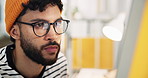 Creative man, web designer and glasses with computer for software development, coding or online update. Male person, employee or programmer with technology for research, new app or design at office
