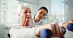 Elderly woman, physiotherapist and arms with weights for physical activity or muscle recovery at clinic. Senior, female person or therpist with patient or weightlifting for health rehabilitation