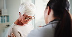 Consultation, upset and senior woman with doctor for diagnosis with bad news in hospital. Comfort, sad and healthcare worker with elderly female patient for support with medical results in clinic.