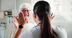 Clinic, senior woman and high five for doctor, checkup and celebration for positive results and healthcare. Happy, medical professional and gesture for elderly patient in hospital, people and success