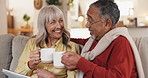 Senior, home or happy couple with tablet, investment profit or stocks results with tea. Interracial marriage, coffee toast or elderly people with retirement savings, financial growth or news update