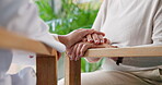 Doctor, elderly person and holding hands for comfort of bad news, compassion and medical diagnosis. People, empathy and console patient for healthcare, health crisis and helping with treatment advice