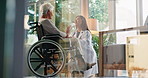 Senior woman, doctor or patient with wheelchair for healthcare treatment or discussion at clinic. Female people, medical worker or talking to elderly person with a disability for diagnosis or results