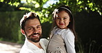 Child, dad and smile on face outdoor in garden with family, growth and happiness. Portrait, female kid and man in nature for holiday with father and daughter for love, care and bonding together