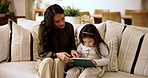 Home, reading and mother with child for tablet, support and education story for cognitive development. Couch, talk and mom with girl for digital ebook, learning website and bonding together in house