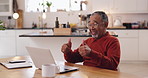 Senior, happy man and laptop with thumbs up for winning, good news or thank you in kitchen at home. Elderly, male person or pensioner with computer, smile or like emoji for retirement success or fund