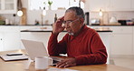 Home, laptop and old man in kitchen, headache and mistake with glitch, connection and stress. Apartment, pensioner and elderly person with computer, migraine and bankruptcy with pressure and internet