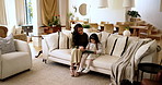 Home, reading and mother with girl for tablet, support and education story for cognitive development. Couch, talk and mom with child for digital ebook, learning website and bonding together in house
