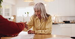 Handshake, senior woman and meeting in home, smile and talking to man for pension and retirement planning. Greeting, financial advisor and shaking hands with elderly person in house, advice and funds