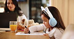 Child, headphones and drawing with remote working parent for art activity, music and colouring. Girl kid, homework and technology at family home with freelancing mother, learning and streaming online
