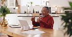 Senior, happy man and laptop with thumbs up for good news, winning or thank you in kitchen at home. Elderly, male person or pensioner with computer, smile or like emoji for retirement success or fund