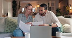 Couple, finance and documents with laptop on sofa at night for budget discussion, planning or expenses. Man, woman or reading financial paperwork with computer for online investment or bills at home