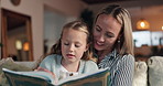 Reading, relax and mother with child for book in living room together with storytelling for bonding. Calm, happy and mom with girl in living room for education, teaching and learning fantasy in home.