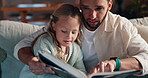 Reading, relax and father with child for book in living room together with storytelling for bonding. Calm, happy and dad with girl in living room for education, teaching and learning fantasy in home.
