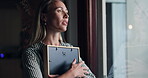 Woman, picture and sad by window at home with memory, mourning and regret or loss of loved one. Female person, widow and hug photo frame with sorrow at house with nostalgia, lonely and reflection