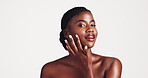 Black woman, skincare and oil for face, dermatology and clean shine for wellness in studio. Female person, portrait and dropper with serum for facial cosmetics and hyaluronic acid on white background