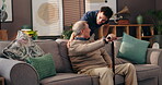 Home, caregiver and senior man with walking stick for mobility, support and communication on sofa. House, physiotherapist and elderly male person with disability for rehabilitation, talking and cane