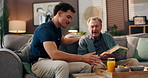 Caregiver, old man and breakfast tray with meal for eating, health and wellness at retirement home. Reading book, homecare service and healthcare worker with senior person for morning food nutrition