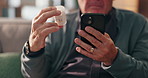 Hands, phone and pills with old man for healthcare, check online info for dosage, prescription and reading medical label. Home, telehealth instruction or pharmaceutical details for tablets on web