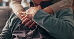 Love, support and holding hands with old couple on sofa for trust, bonding and kindness. Retirement, connection and solidarity with closeup of senior people in living room of nursing home for care