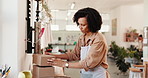 Business, packaging and woman in workshop, boxes or ecommerce with cardboard. Person, supply chain or entrepreneur in studio, prepare order for shipping, art product or delivery for fragile goods