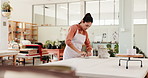 Clay, creative and woman in workshop for pottery with molding shape for project, manufacturing or skill. Mud, artisan and female ceramist with handmade process for ceramic sculpture production.