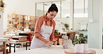 Clay, pottery and woman in workshop for molding shape with creative project, manufacturing or skill. Mud, artisan and female ceramist with handmade process for ceramic sculpture production in store.