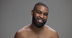 Studio, black man and face with happiness for skincare, hygiene and model with confidence for wellness. Mockup space, male person and smile in portrait for dermatology, cosmetics and gray background