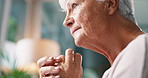 Thinking, regret and elderly woman with anxiety in living room of retirement home with dementia. Trauma, worried and lonely senior female person with alzheimer, sad memory nostalgia and depression