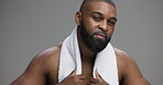 Shower, beauty and face of black man in studio for towel, hygiene and grooming. Model, self care and cosmetics with portrait of male person on gray background for skincare, salon and dermatology