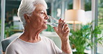 Thinking, water and senior woman in home for wellness, health and nutrition in living room for calm. Retirement, nursing and elderly person with liquid for thirsty, hydration and detox for reflection