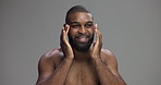 Face, skincare and black man apply moisturizer for treatment, dermatology or think. Cosmetics, cream and happy person with beauty lotion for hydration or natural glow on gray studio background space