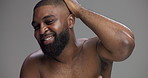 Hair, skincare and face of black man in studio for beauty, shampoo and grooming. Hairstyle, self care and cosmetics with portrait of person on gray background for barber, scalp and dermatology