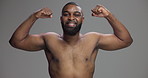 Studio, black man and face with flexing for muscle, strong arms and confidence for fitness progress. Happiness, male person and bodybuilder with bicep in portrait, workout results and gray background