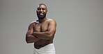 Studio, man and face with confidence for skincare, hygiene and model with arms crossed for wellness. Mockup space, black person and smile in portrait for dermatology, cosmetics and gray background