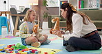Psychology, talking or toys with therapist and child for playing games, learning development and story. Classroom, wellness therapy and fairy tale with girl, kid student or woman with stuffed animal