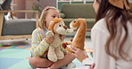 Girl, talking or toys with therapist and child for playing games, learning development and story. Psychology, wellness therapy and fairy tale with animals, kid student or woman with stuffed animal 