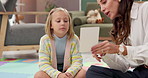 Cards, psychologist or woman in office, girl or adhd with conversation, speech therapy or help with lisp. Mature person, language learning or child with questions, counseling evaluation or consulting