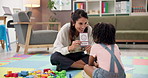 Talking, psychologist and woman with child, cards or adhd with education, questions or help. Consulting, therapist and girl kid in therapy with counseling evaluation, development or language learning