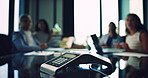 Boardroom, conference call and business people in meeting with telephone for feedback, review and planning. Corporate, professional and blur of workers for contact, conversation and communication