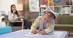 Therapy, child and development with drawing for education, social worker and learning behavior for adhd. Assessment, therapist and girl with headphones for creative activity, art and test for autism