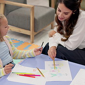 Woman, teacher or child with drawing for assessment, fine motor skills ...