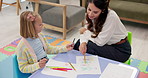 Woman, teacher or child with drawing for assessment, fine motor skills or lesson at home. Female person, assessor or private tutor with kid, student or elementary girl with sketch or art for learning